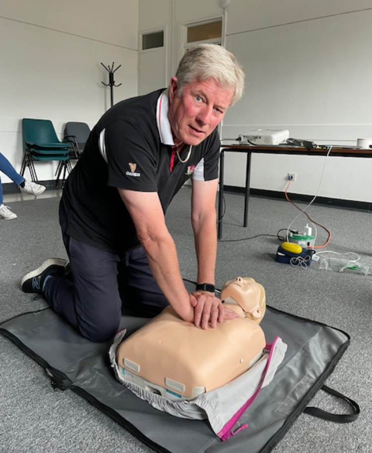 Photo of Andrew doing cpr